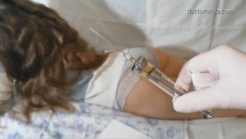 female patient gets vitamin injections